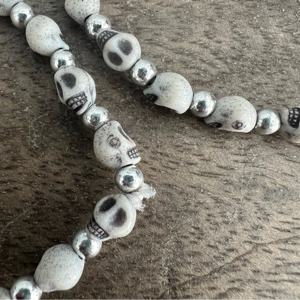 Skull face and silver tone bead stretch bracelet set
